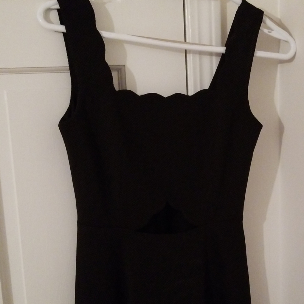 Beautiful black dress worn once, small open cut ou